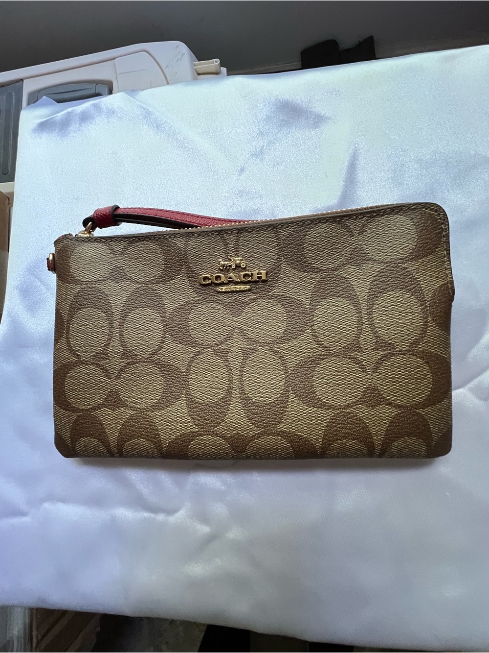 Coach Brown Signature Canvas Wristlet with Pink Strap